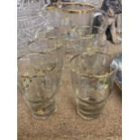 A VINTAGE GLASS LEMONADE SET FLORAL WITH GOLD RIM