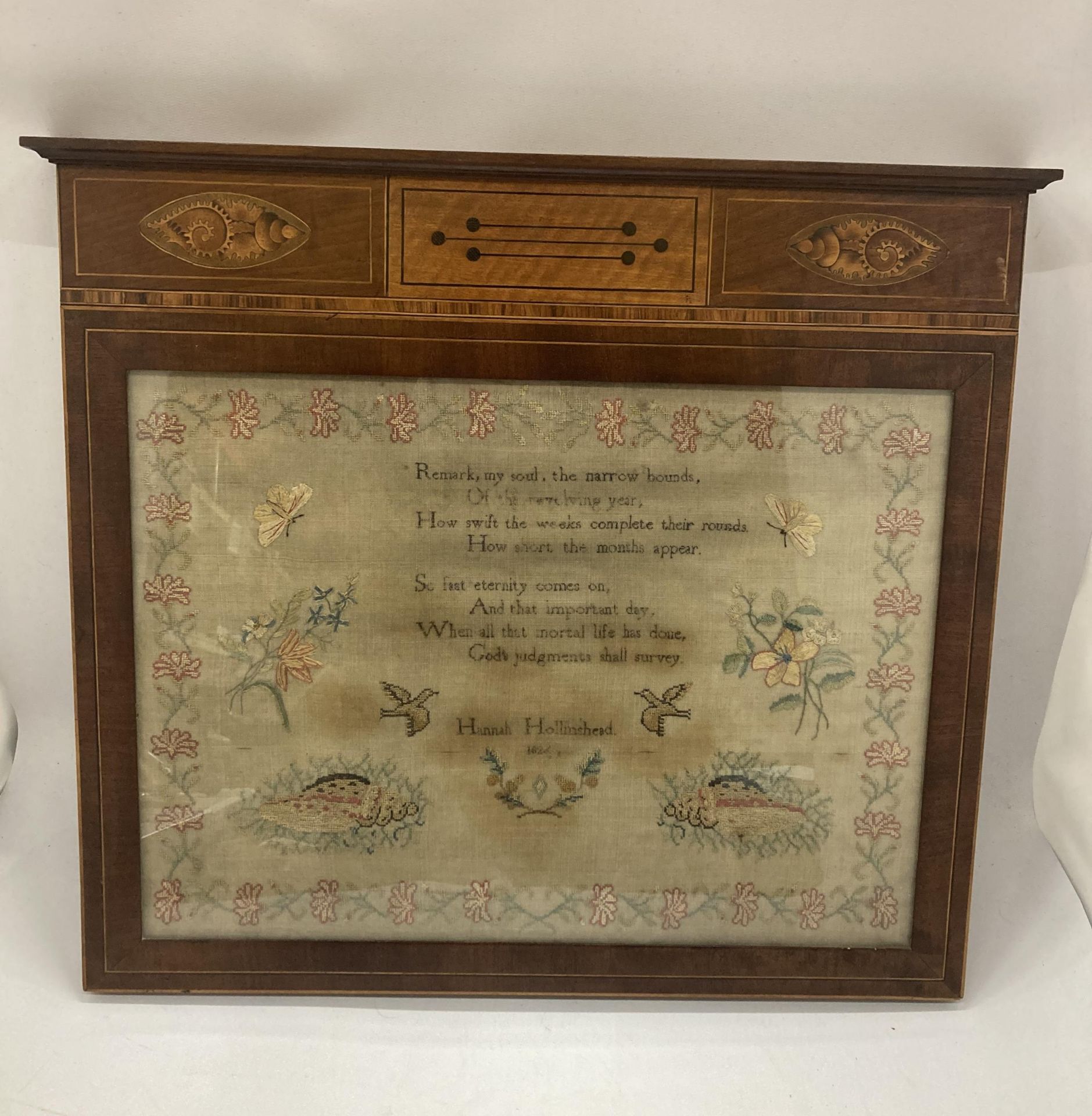 A GEORGIAN POEM TAPESTRY DATED 1826 IN INLAID MAHOGANY FRAME WITH CONCH SHELL DESIGN