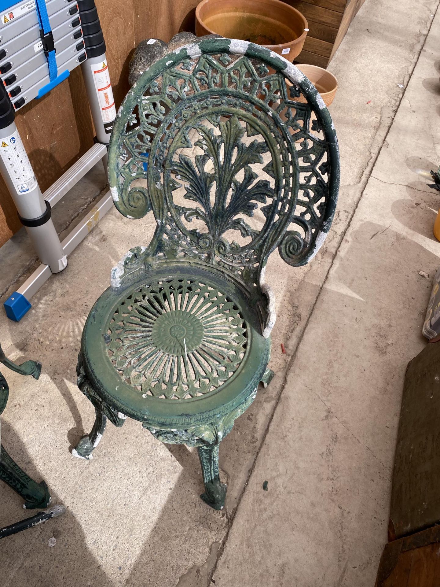 A VINTAGE CAST ALLOY BISTRO SET COMPRISING OF A ROUND TABLE AND FOUR CHAIRS - Image 3 of 4