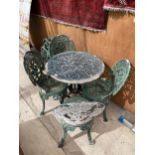 A VINTAGE CAST ALLOY BISTRO SET COMPRISING OF A ROUND TABLE AND FOUR CHAIRS