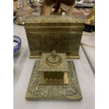 AN ASIAN STYLE BRASS STATIONERY BOX WITH COMPARTMENTS AND INKWELL WITH GLASS LINER, BOTH WITH FLORAL