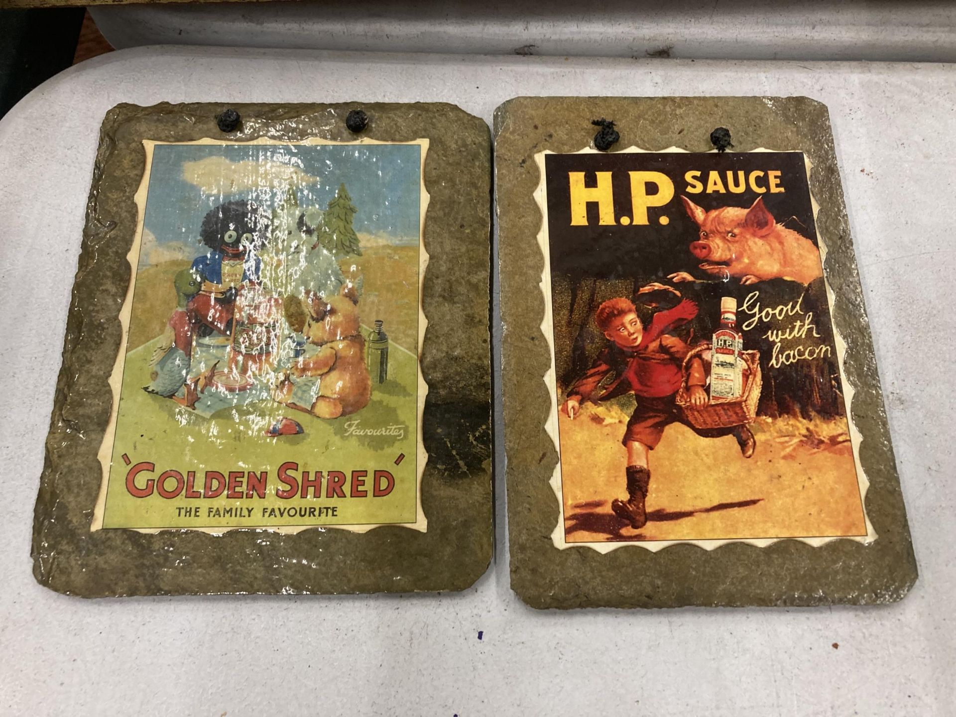 TWO ADVERTISING WALL PLAQUES - GOLDEN SHRED AND H. P. SAUCE 13CM X 19CM