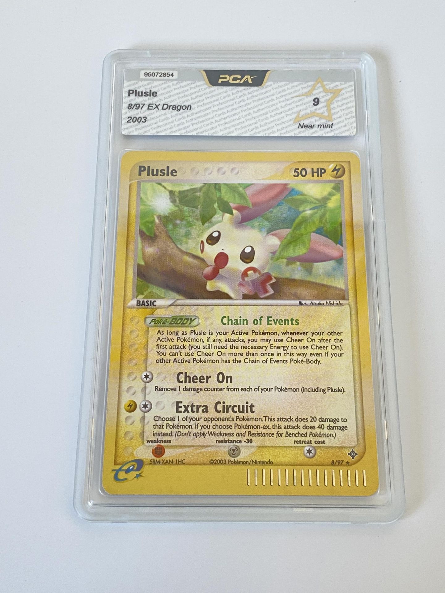 A GRADED POKEMON CARD -PLUSLE 8/97 EX DRAGON - PCA GRADE - 9