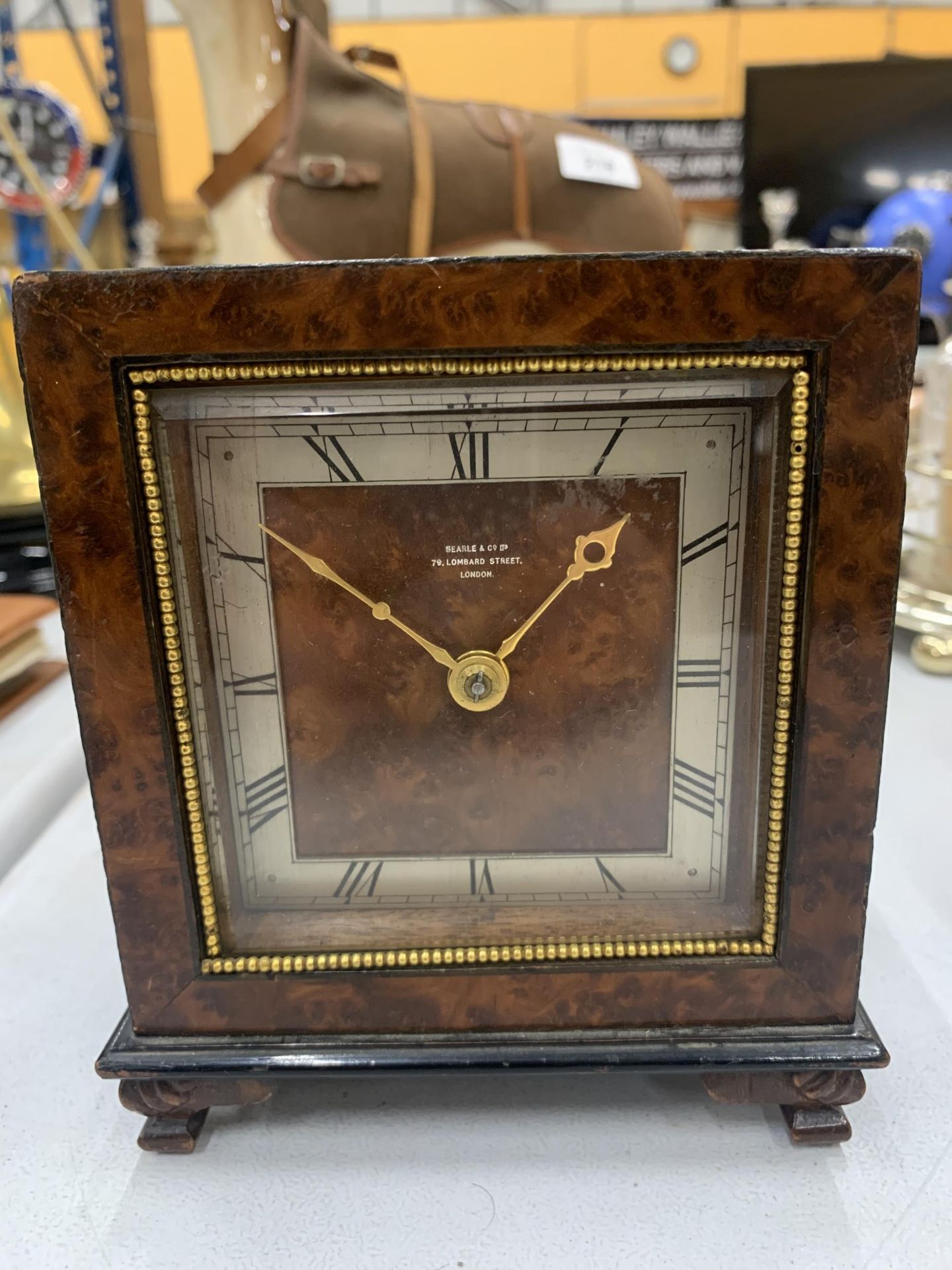 A PRE 1936 BURR WALNUT MANTLE CLOCK WITH KEY - MARKED SEARLE & CO, LOMBARD STREET, LONDON