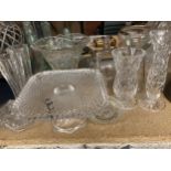A LARGE QUANTITY OF GLASSWARE TO INCLUDE A CAKE STAND, TRINKET POT, VASES, CANDLESTICK ETC.,