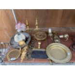 A LARGE ASSORTMENT OF BRASS ITEMS TO INCLUDE A TRIVET STAND, FIRE DOGS, LIGHT FITTINGS AND A