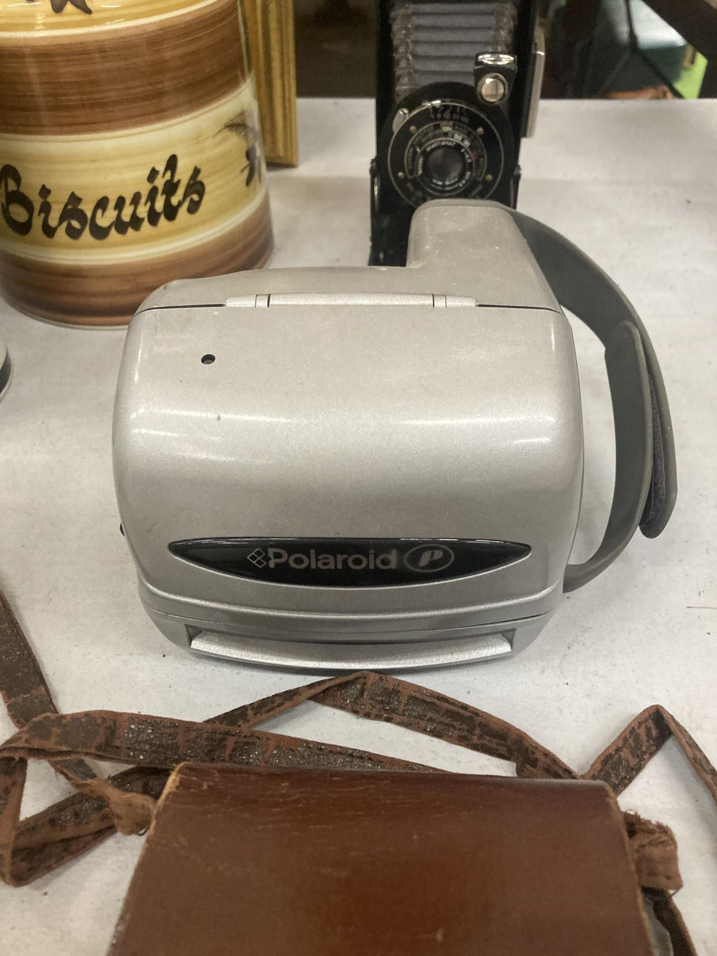 A VINTAGE KODAK CAMERA WITH BELLOWS AND LEATHER CASE AND A POLAROID CAMERA - Image 3 of 4