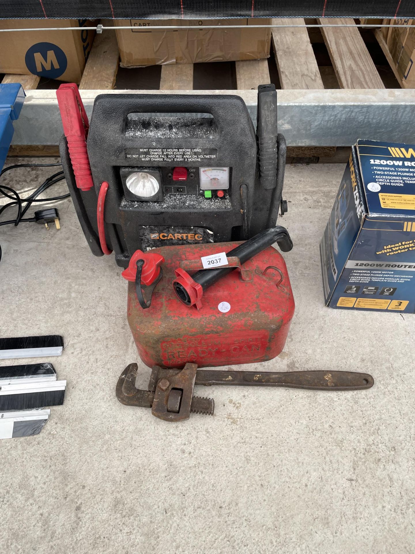 AN ASSORTMENT OF TOOLS TO INCLUDE A FUEL CAN AND A CAR CHARGER ETC