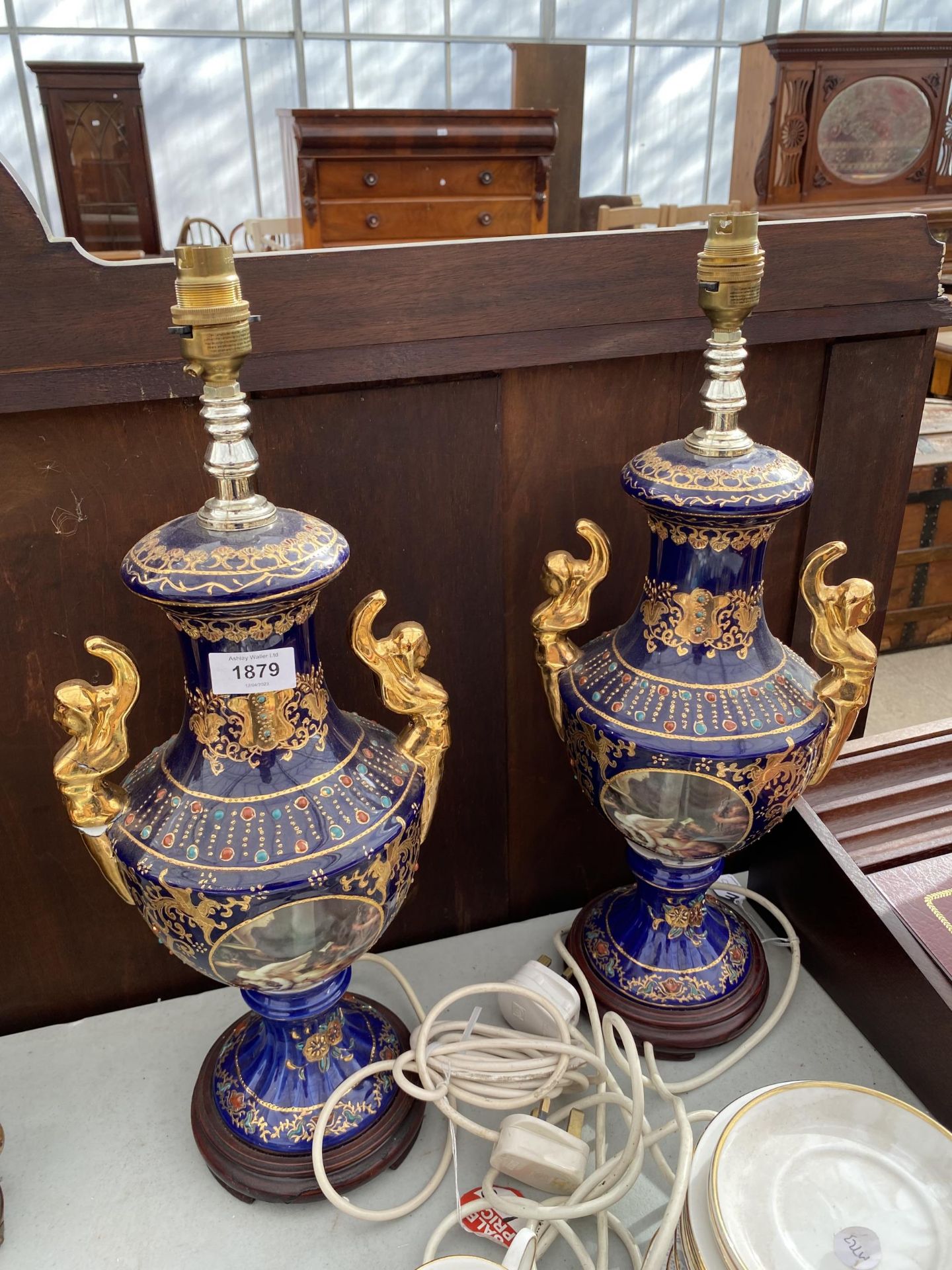 A PAIR OF BLUE CERAMIC ORIENTAL STYLE TABLE LAMPS WITH CHERUB DESIGN A/F