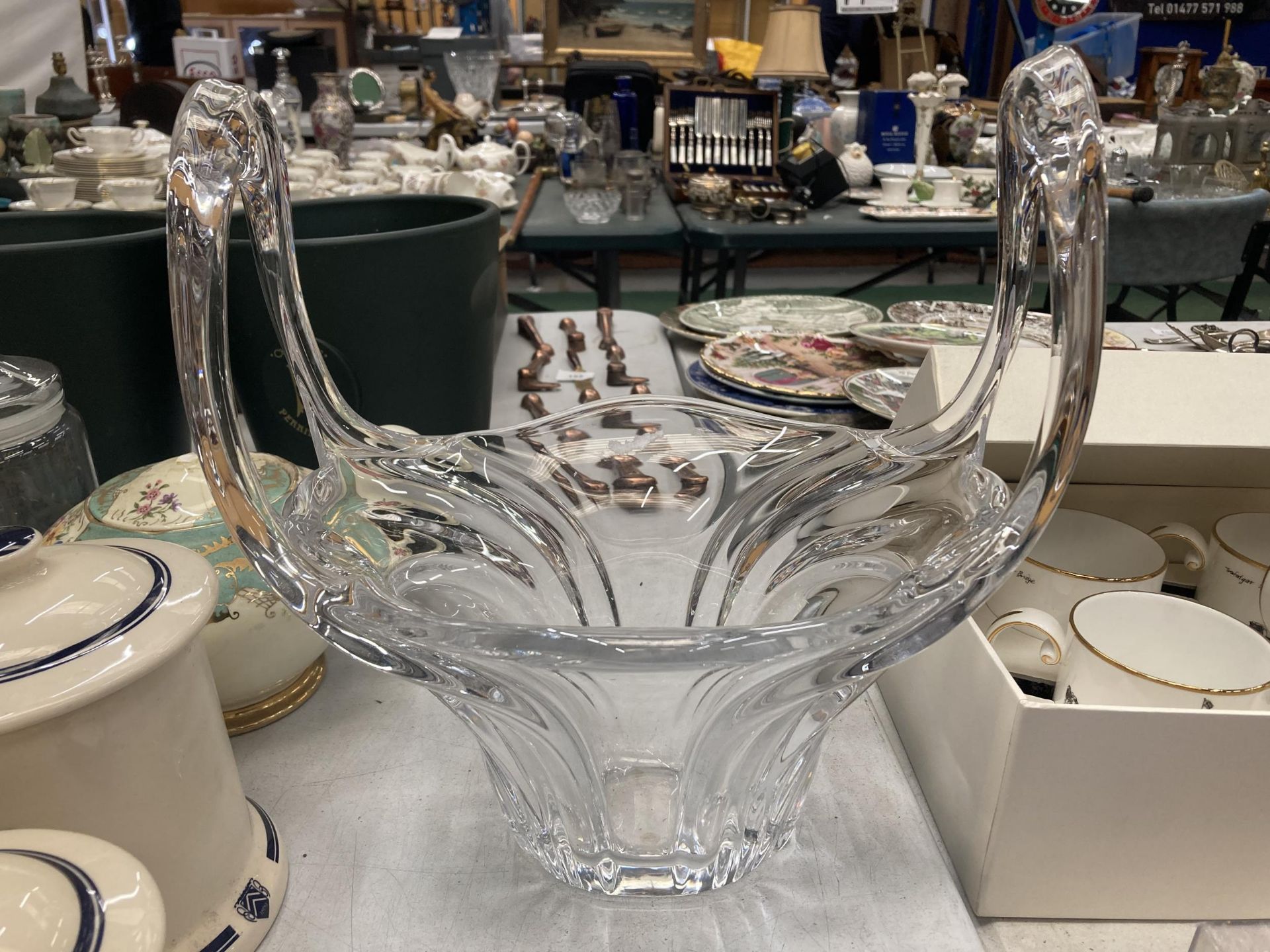 A HEAVY CLEAR ART GLASS TWIN HANDLED BOWL