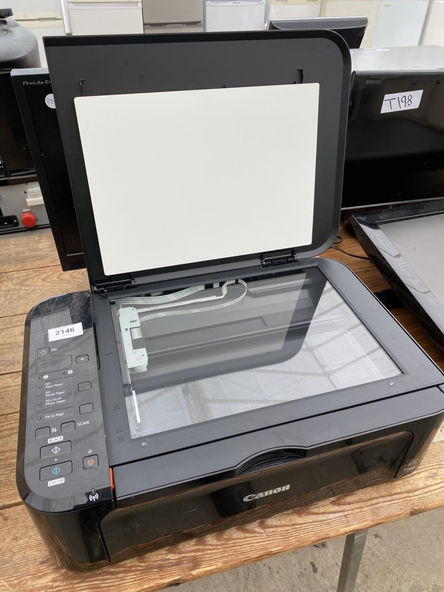 A CANON PRINTER AND A COMPUTER SCREEN