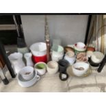 A LARGE ASSORTMENT OF CERAMIC PLANT POTS AND A GLASS VASE ETC