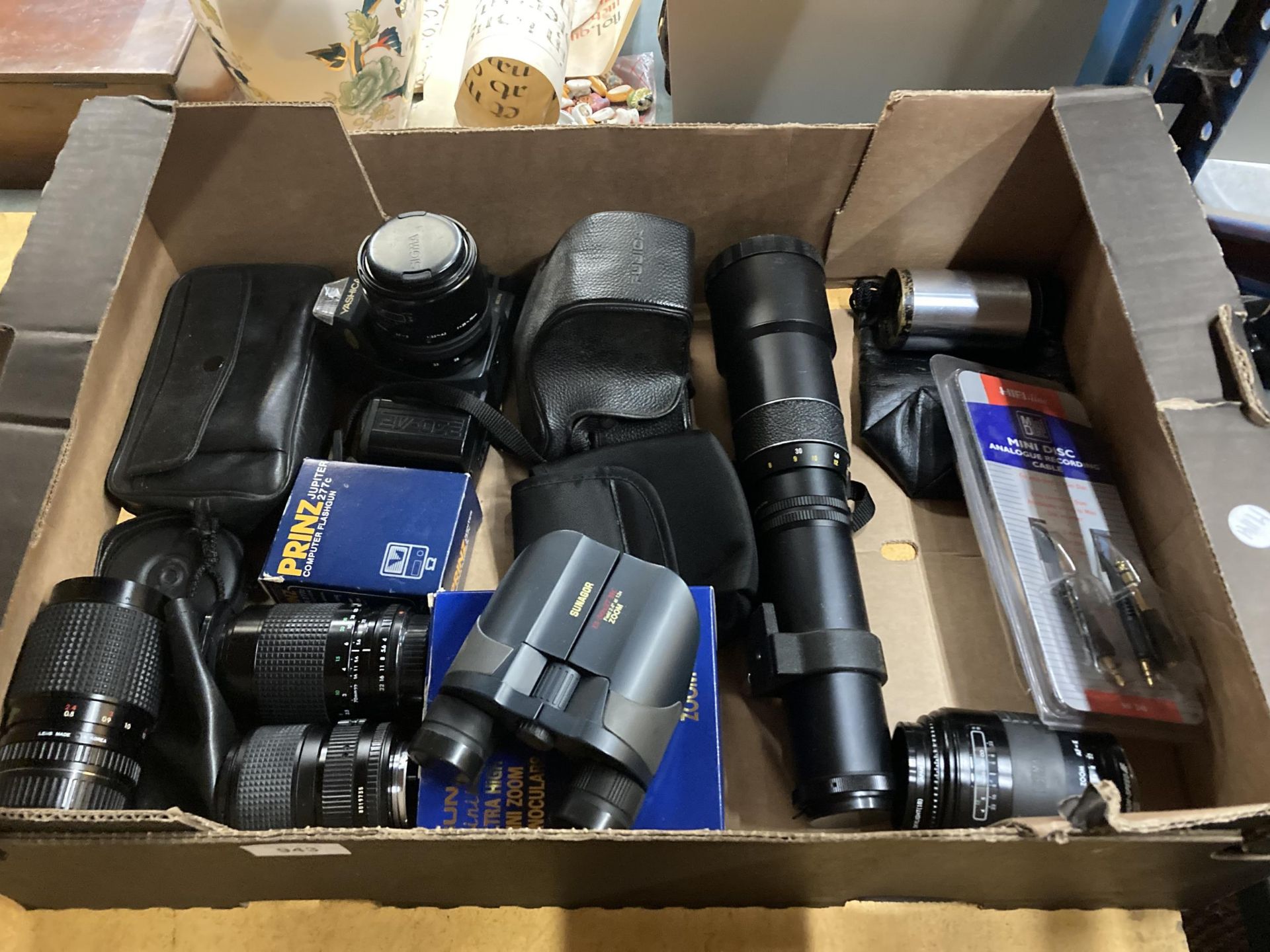 A QUANTITY OF VINTAGE CAMERAS , LENS AND BINOCULARS TO INCLUDE SUNAGOR, YASHICA ETC.,