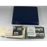 A STAMP ALBUM CONTAINING QUEEN ELIZABETH II MINT AND USED STAMPS, FIRST DAY COVERS AND PACKETS OF