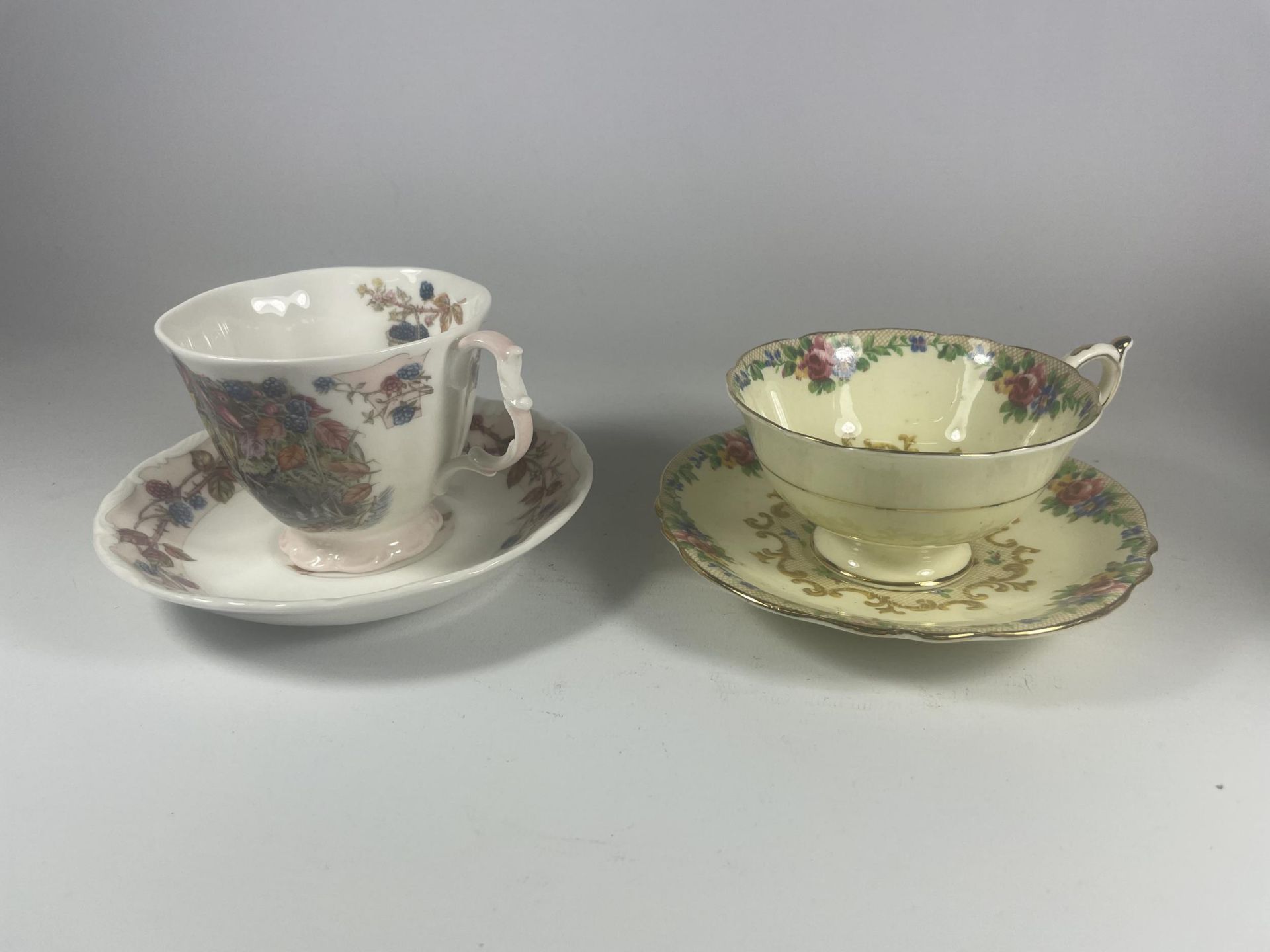 TWO CUPS & SAUCERS - ROYAL DOULTON AUTUMN FOUR SEASON PATTERN & PARAGON MINUET