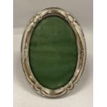 AN EARLY 20TH CENTURY OVAL HALLMARKED SILVER PHOTO FRAME