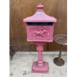 A DECORATIVE RED METAL POST BOX ON PEDESTAL BASE (H:118CM)