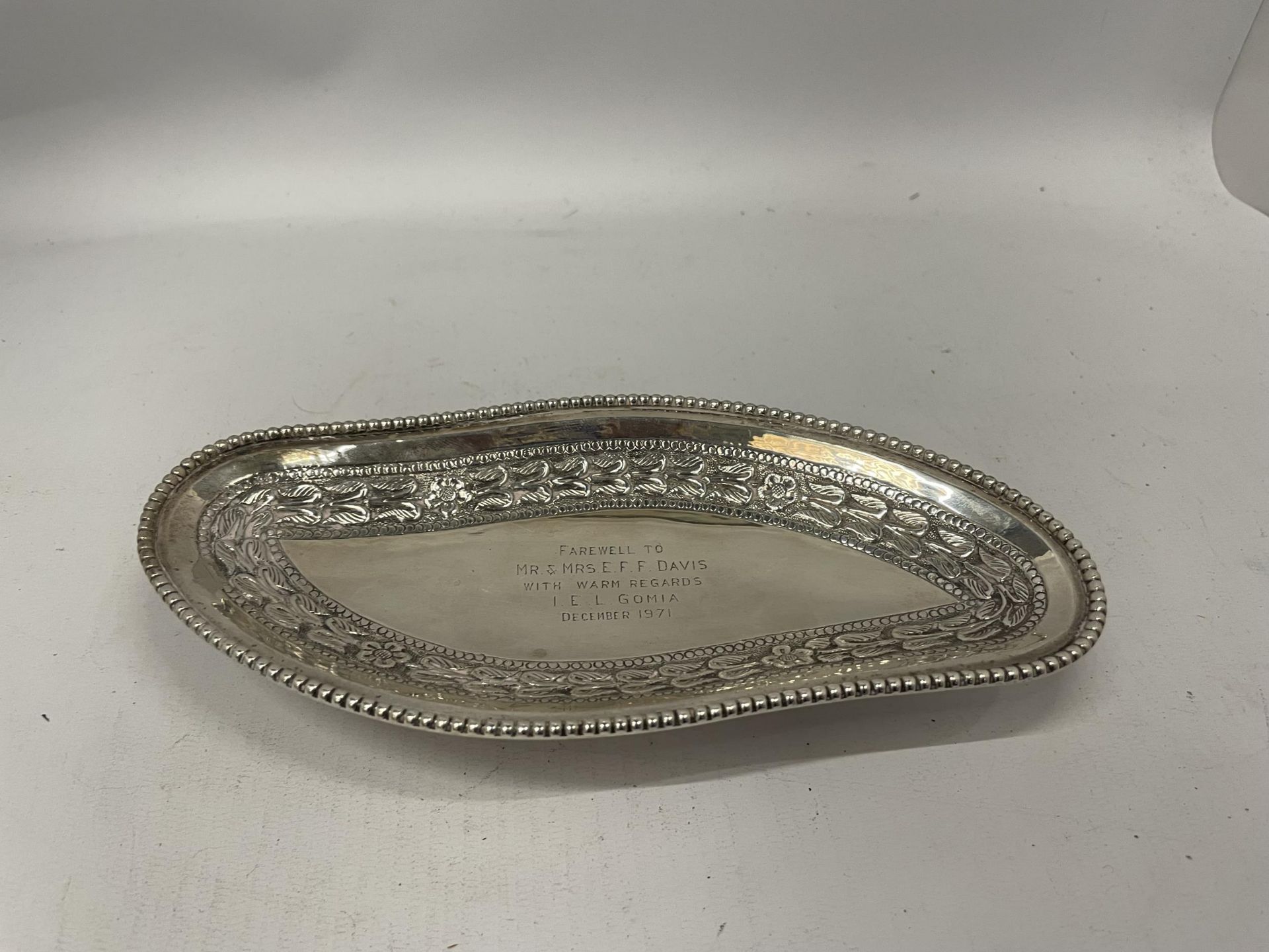 A WHITE METAL PRESENTATION DISH, DATED 1971 ON PIN NEEDLE DESIGN FEET