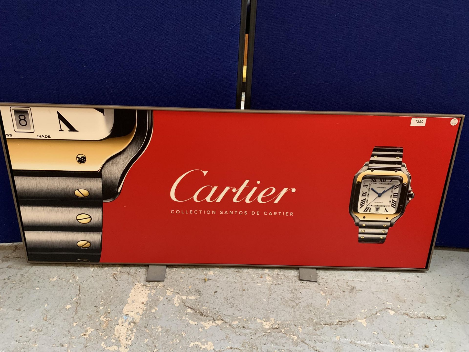 A MODERN PRINT ON BOARD ENTITLED "CARTIER COLLECTION SANTOS DE CARTIER"