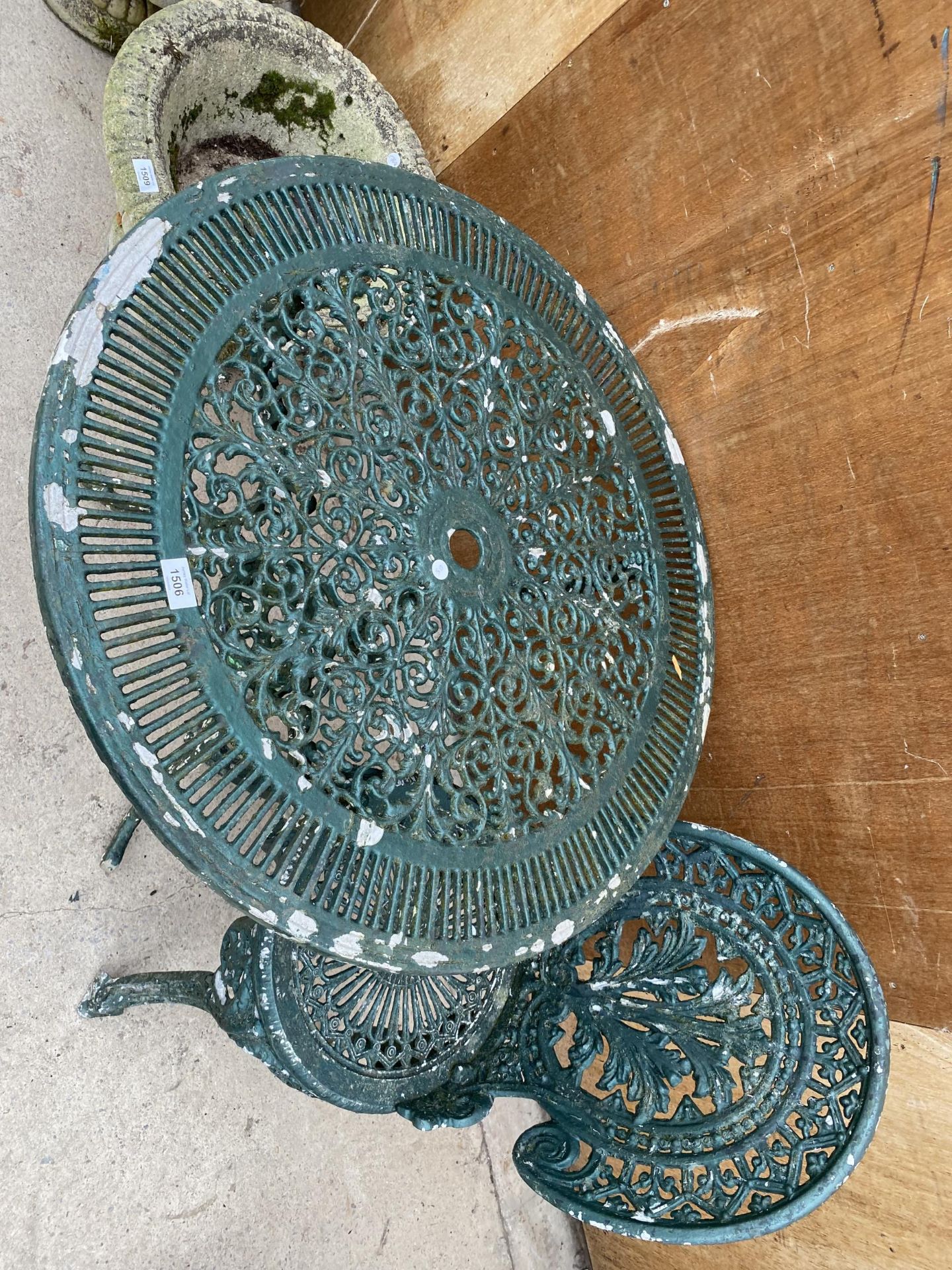 A CAST ALLOY BISTRO SET COMPRISING OF A ROUND TABLE AND ONE CHAIR - Image 2 of 2