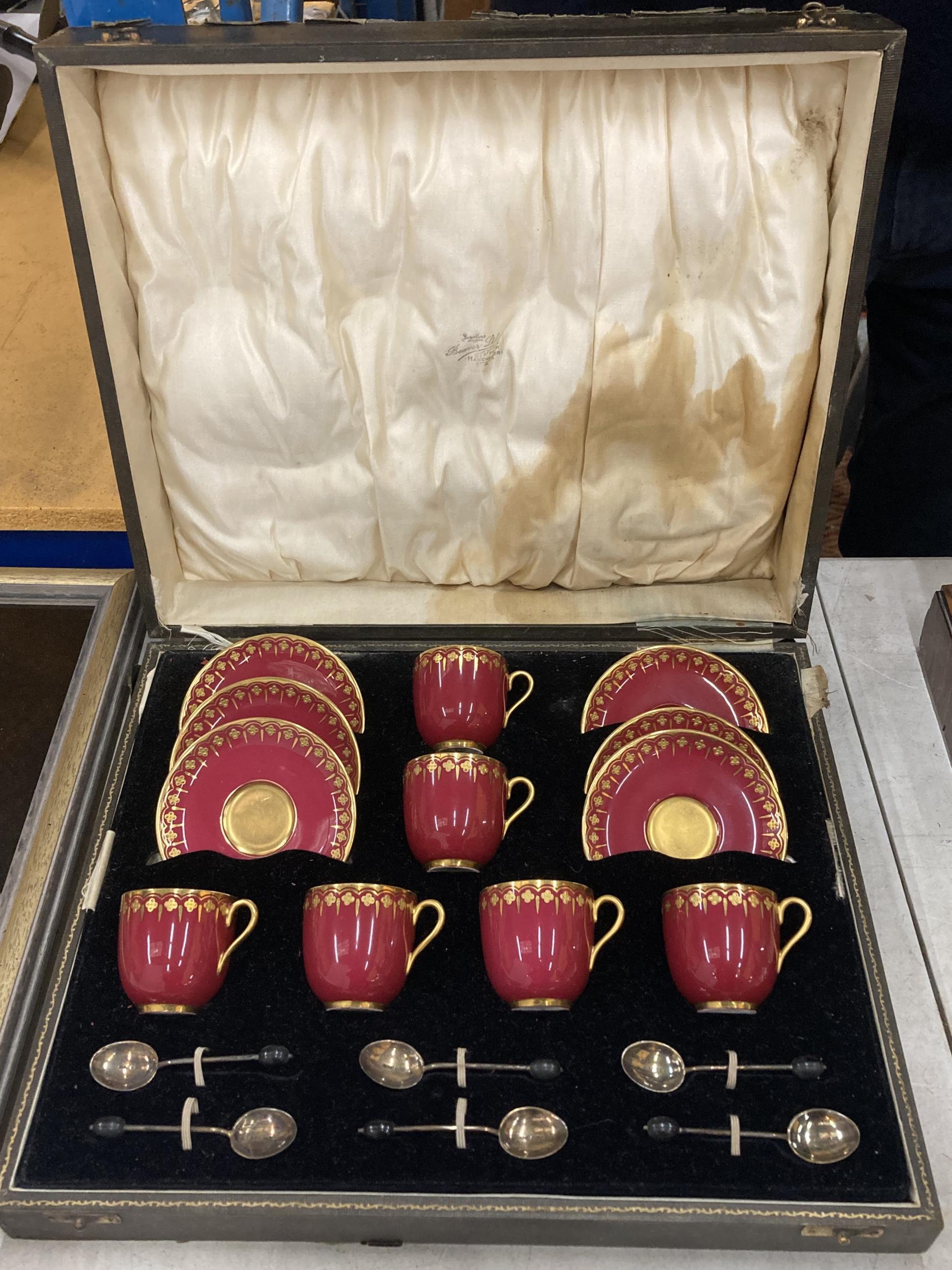 AN ART DECO CASED GILT DESIGN COALPORT TEA SET COMPRISING SIX CUPS & SAUCERS WITH SIX HALLMARKED