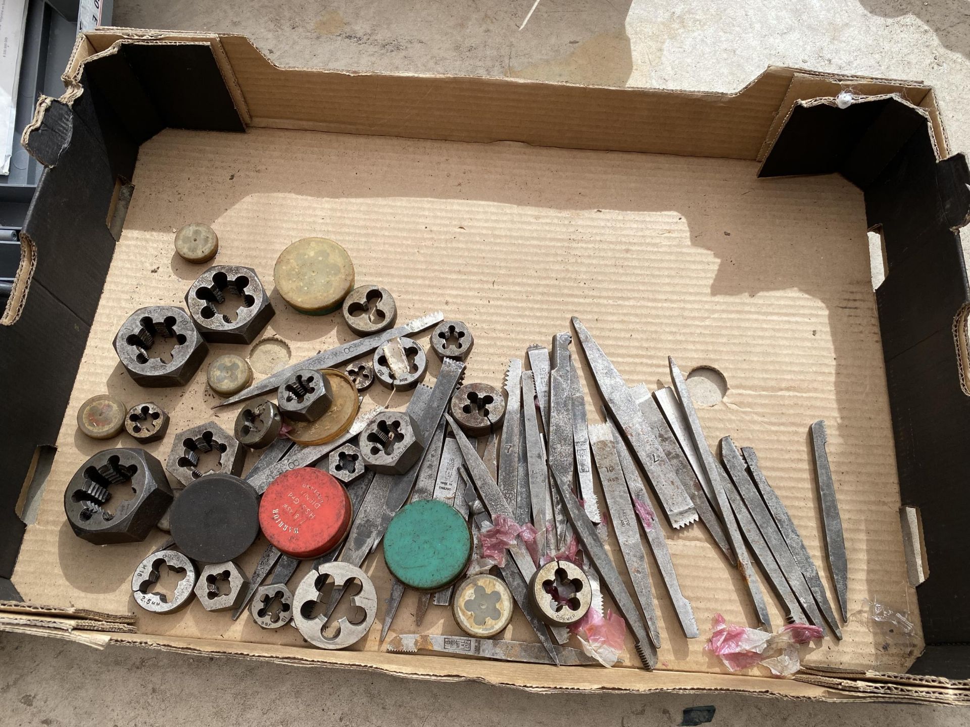 AN ASSORTMENT OF TOOLS TO INCLUDE DIES AND PUNCHES ETC