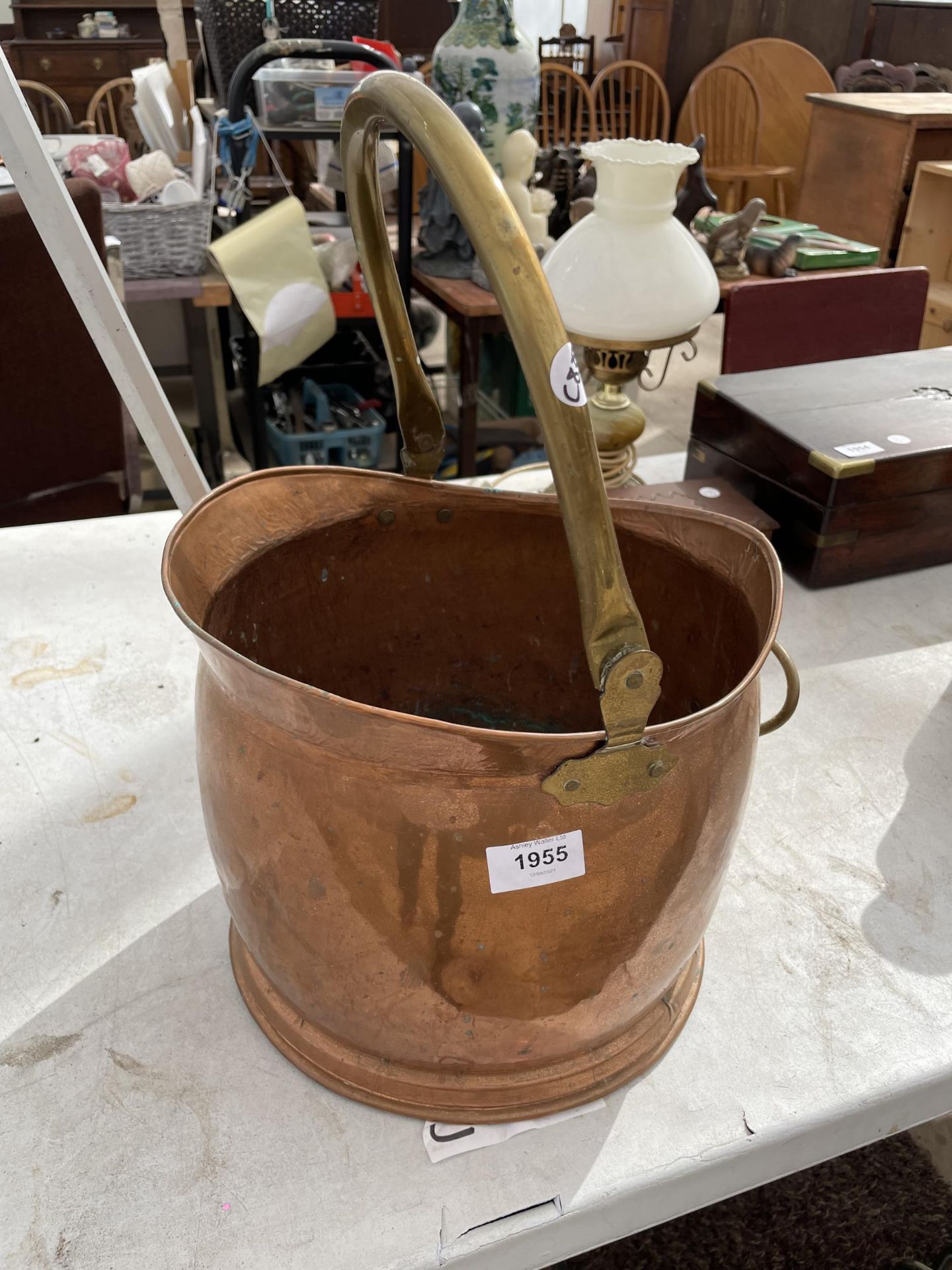A VINTAGE BRASS AND COPPER COAL BUCKET