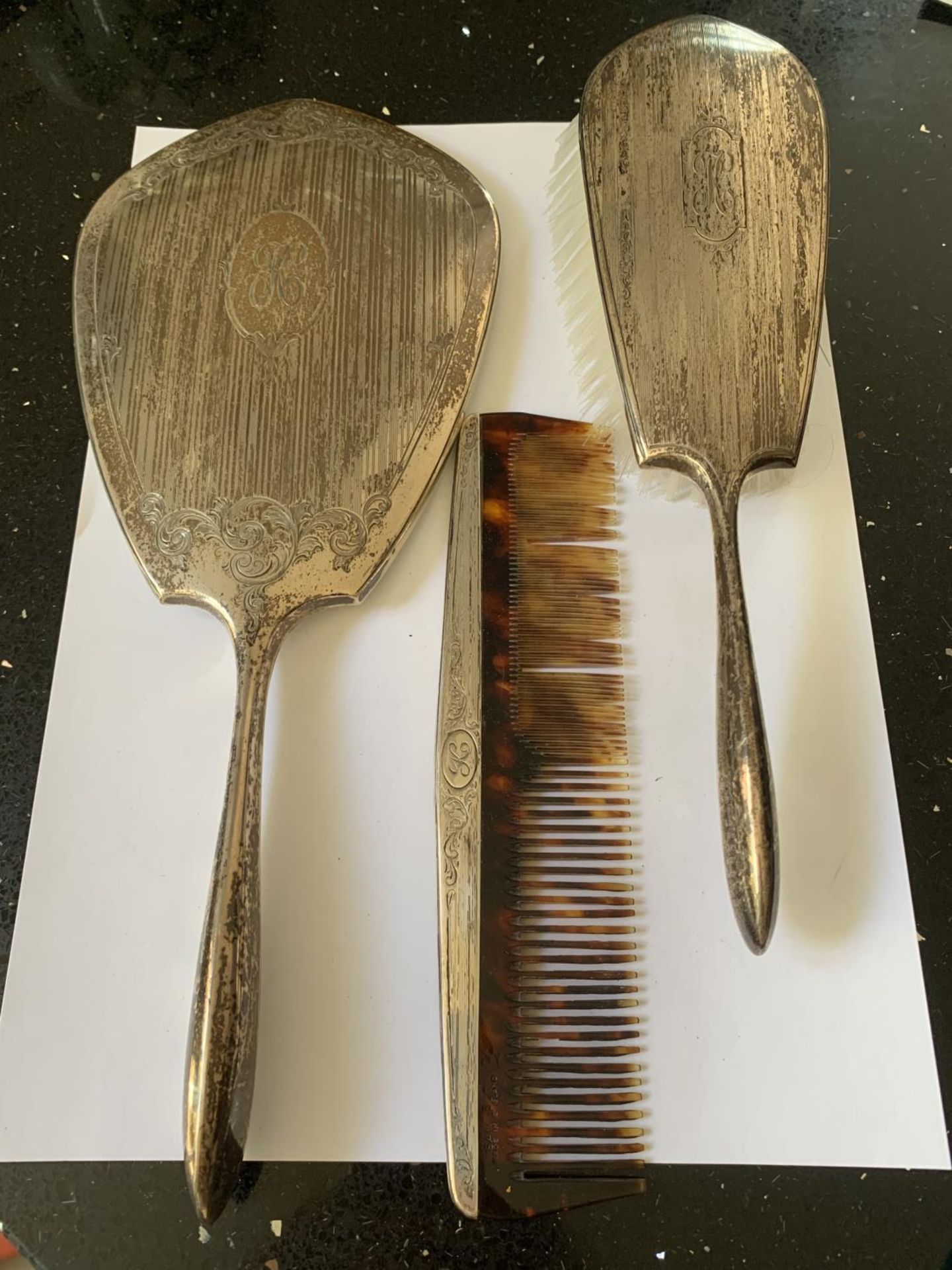 A BIRKS STERLING SILVER VANITY SET COMPRISING OF MIRROR, BRUSH AND COMB