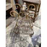 A VINTAGE METAL WINE BOTTLE RACK