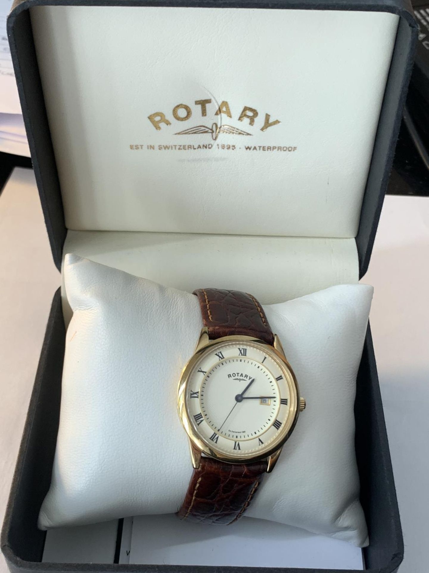 A ROTARY CALENDAR WRISTWATCH IN A PRESENTATION BOX SEEN WORKING BUT NO WARRANTY