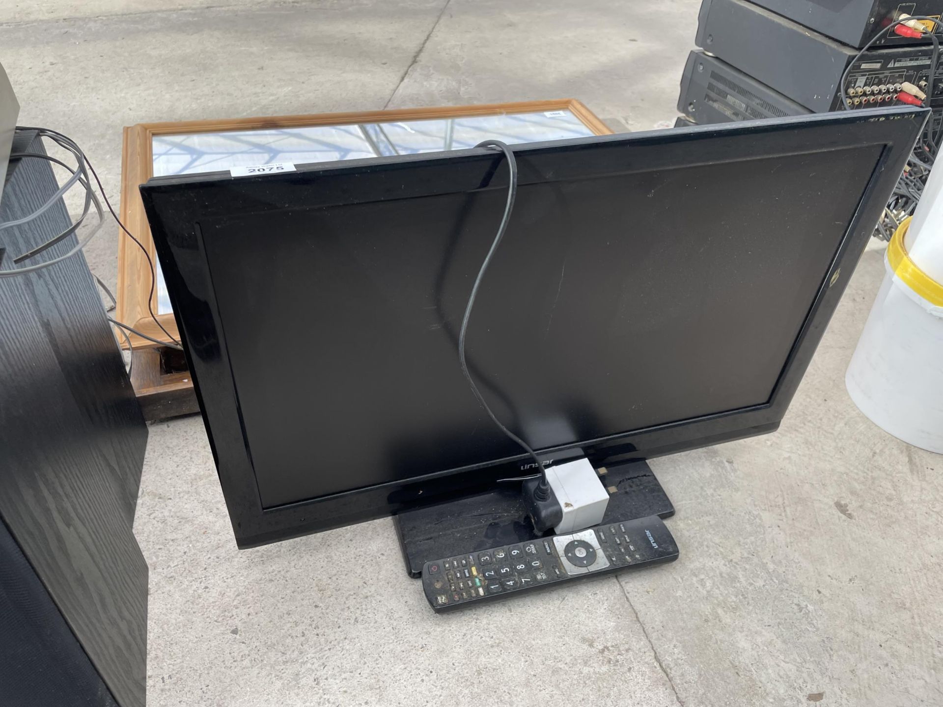 A LINSAR 24" TELEVISION WITH REMOTE CONTROL