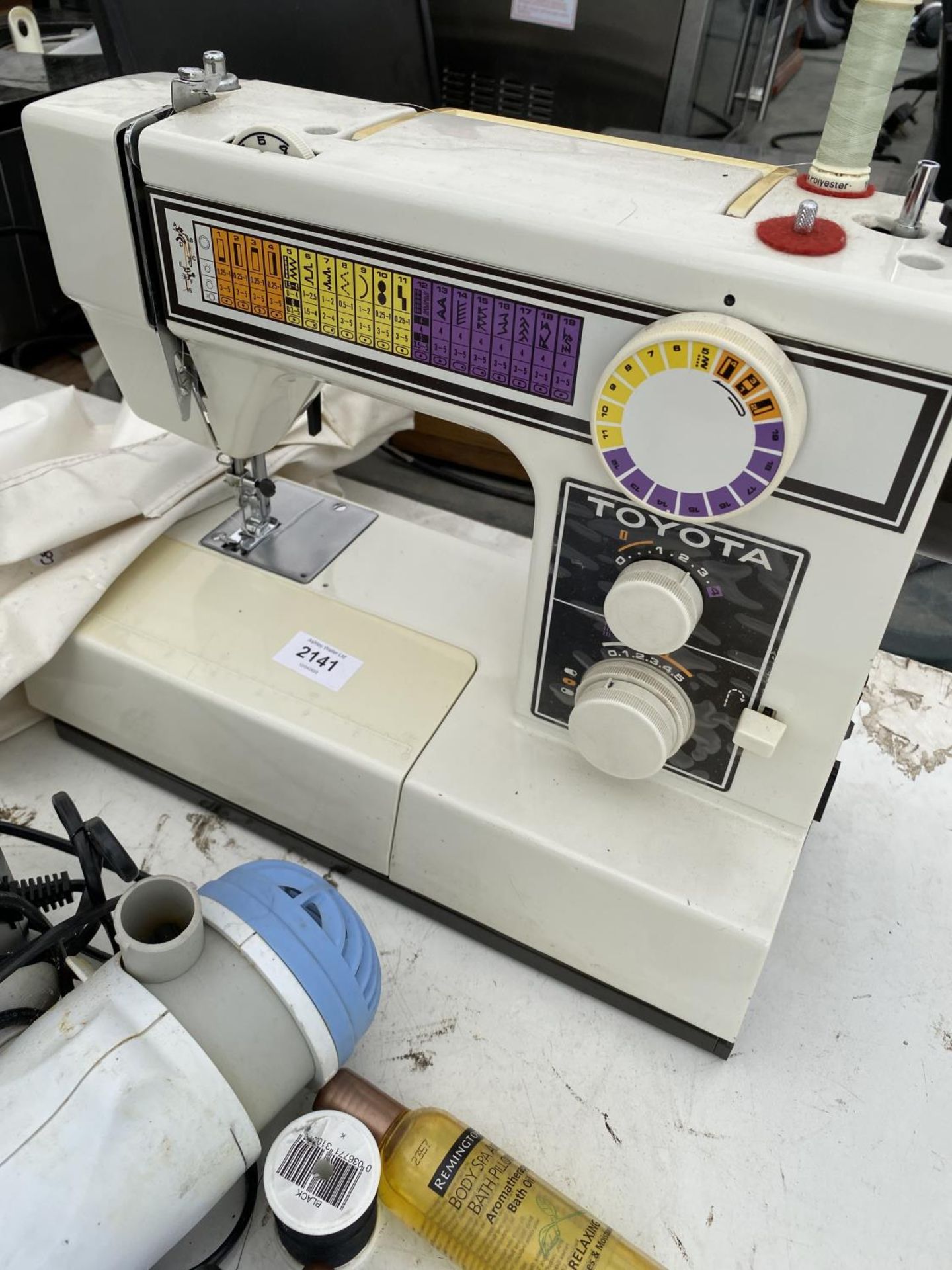 AN ELECTRIC TOYOTA SEWING MACHINE AND A REMINGTON DRYER - Image 2 of 3