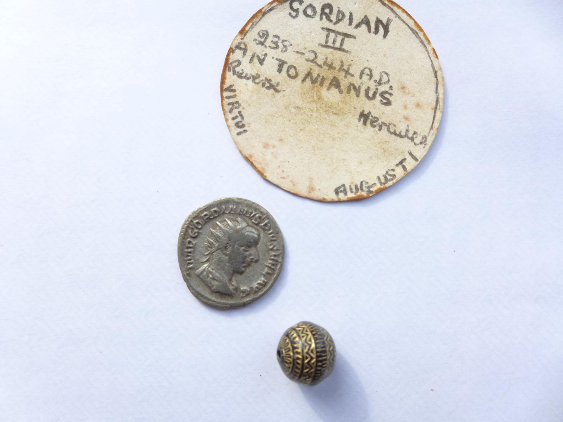 A GORDIAN III (238-244 AD) SILVER ANTONIANUS AND A SMALL METAL BEAD