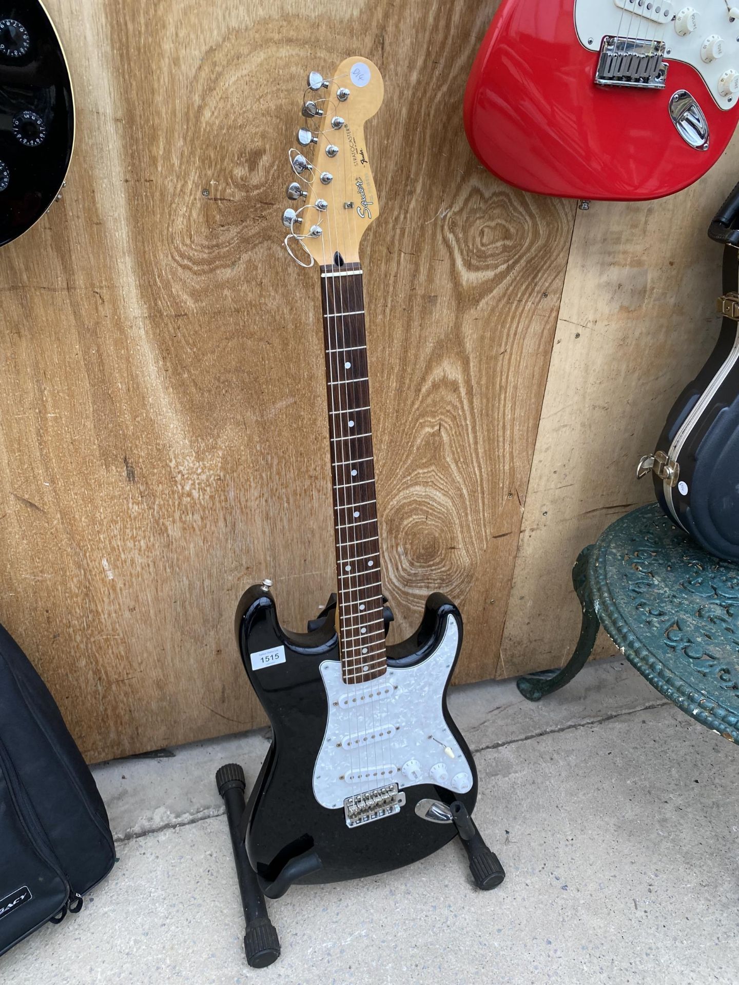A BLACK SQUIRE STRATOCASTER BY FENDER ELECTRIC GUITAR (SERIAL NUMBER: N006099)