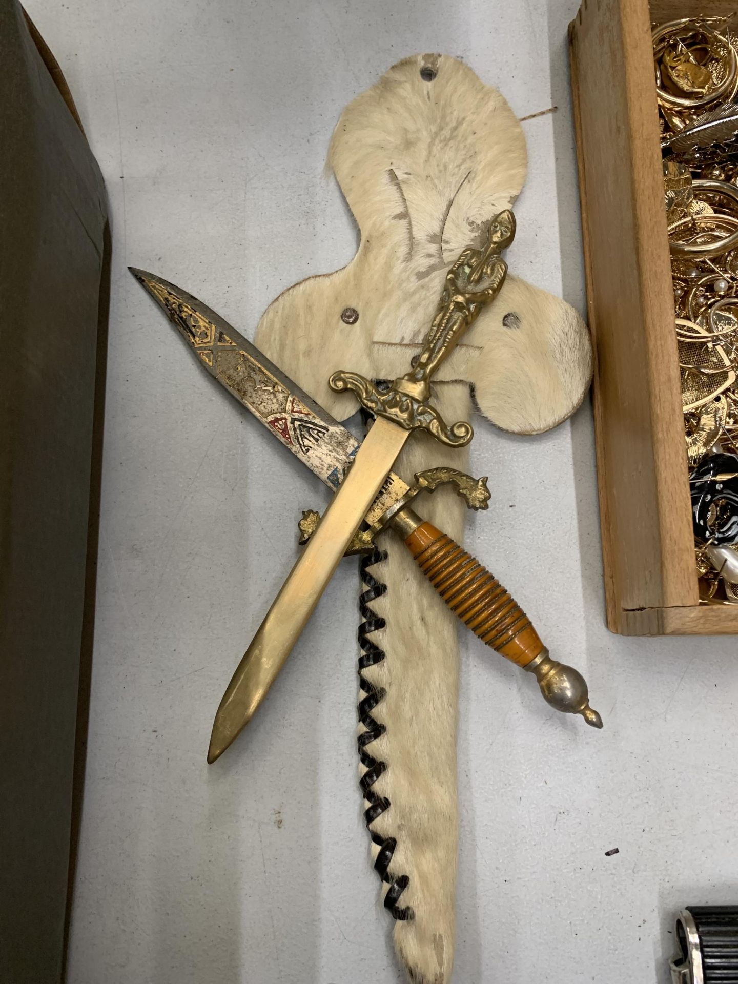 AN ORNATE KNIFE IN AN ANIMAL SKIN SHEATH AND A BRASS LETTER OPENER - Image 4 of 4