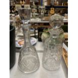 TWO HEAVY CUT GLASS DECANTERS