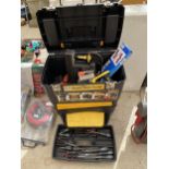 A TWO TIER MOBILE WORK CENTER WITH AN ASSORTMENT OF TOOLS TO INCLUDE SCREW DRIVERS AND SAWS