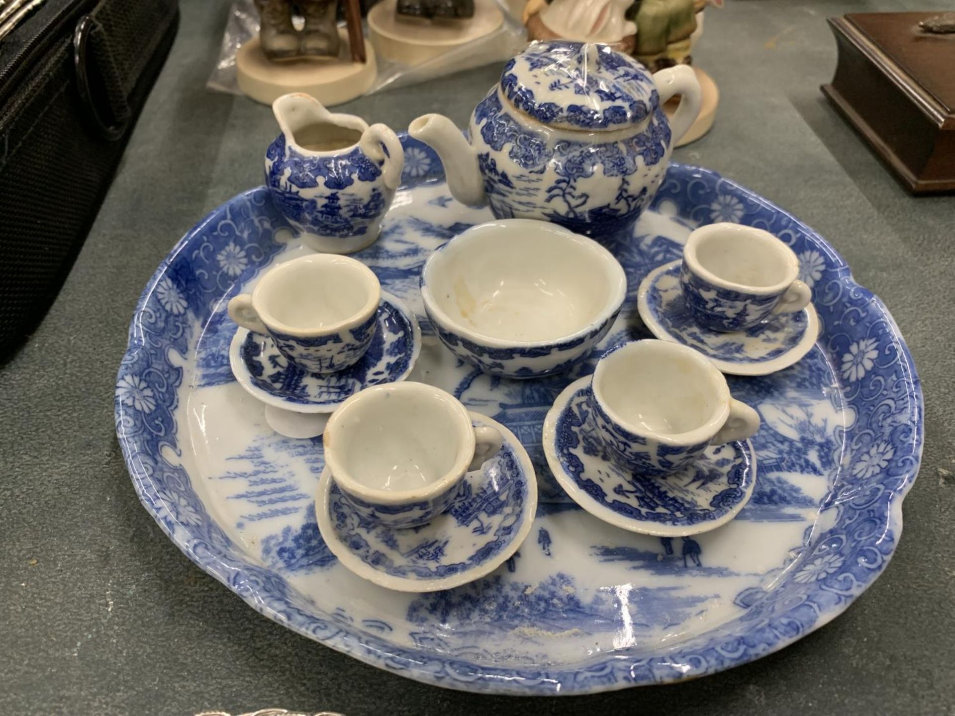 A MINIATURE VICTORIAN BLUE AND WHITE TEASET ON A TRAY