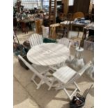 A WOODEN FOLDING GARDEN PATIO SET COMPRISING OF A ROUND TABLE AND FOUR CHAIRS