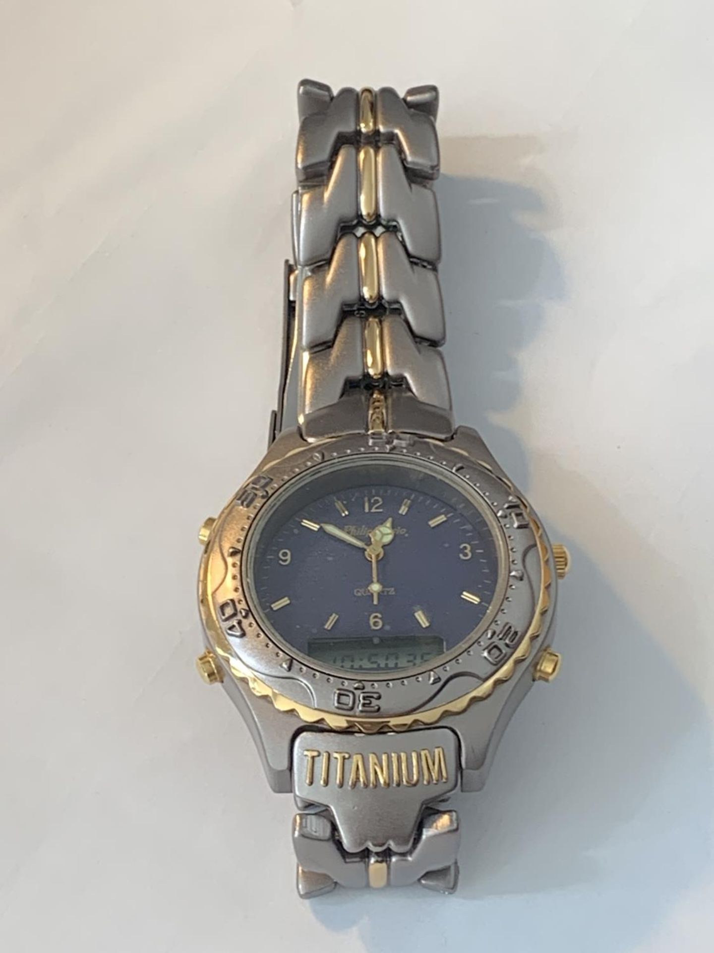 A TITANIUM WRISTWATCH SEEN WORKING BUT NO WARRANTY