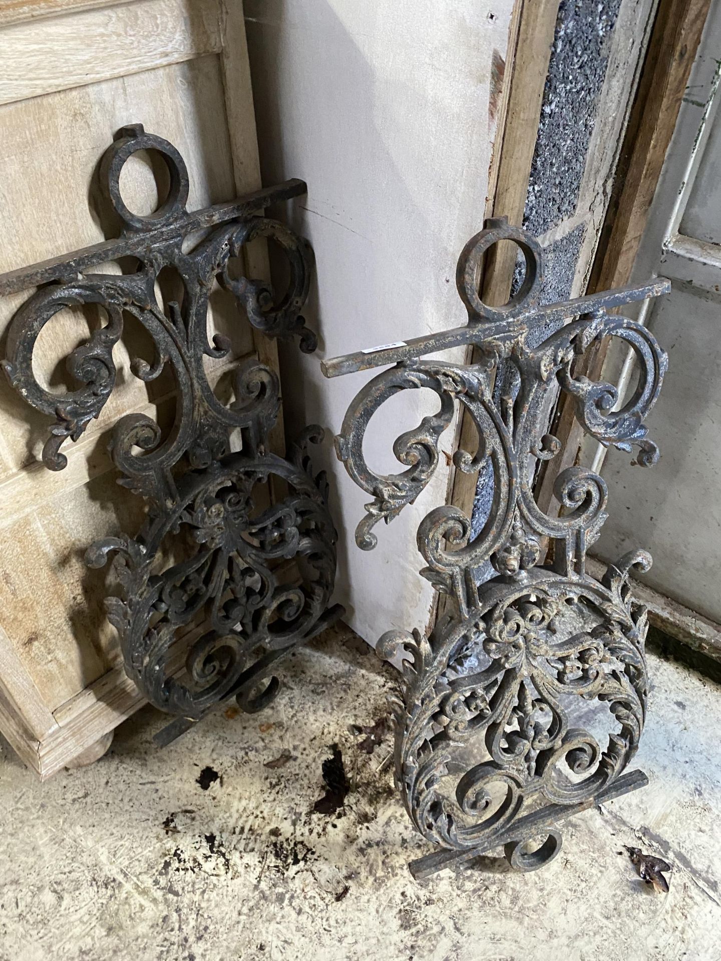 A PAIR OF CAST IRON PANELS