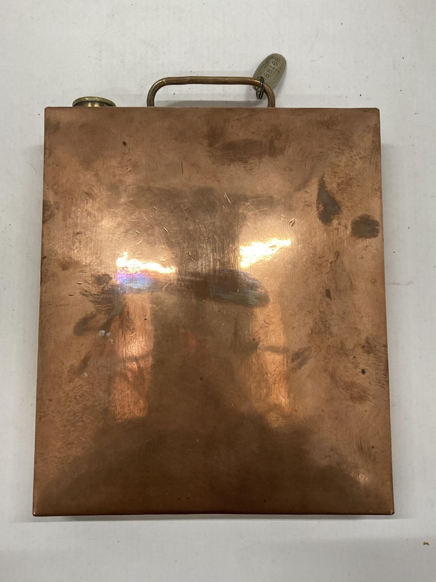 A VINTAGE COPPER CAR WATER BOTTLE WITH RETURN TO OWNER TAG