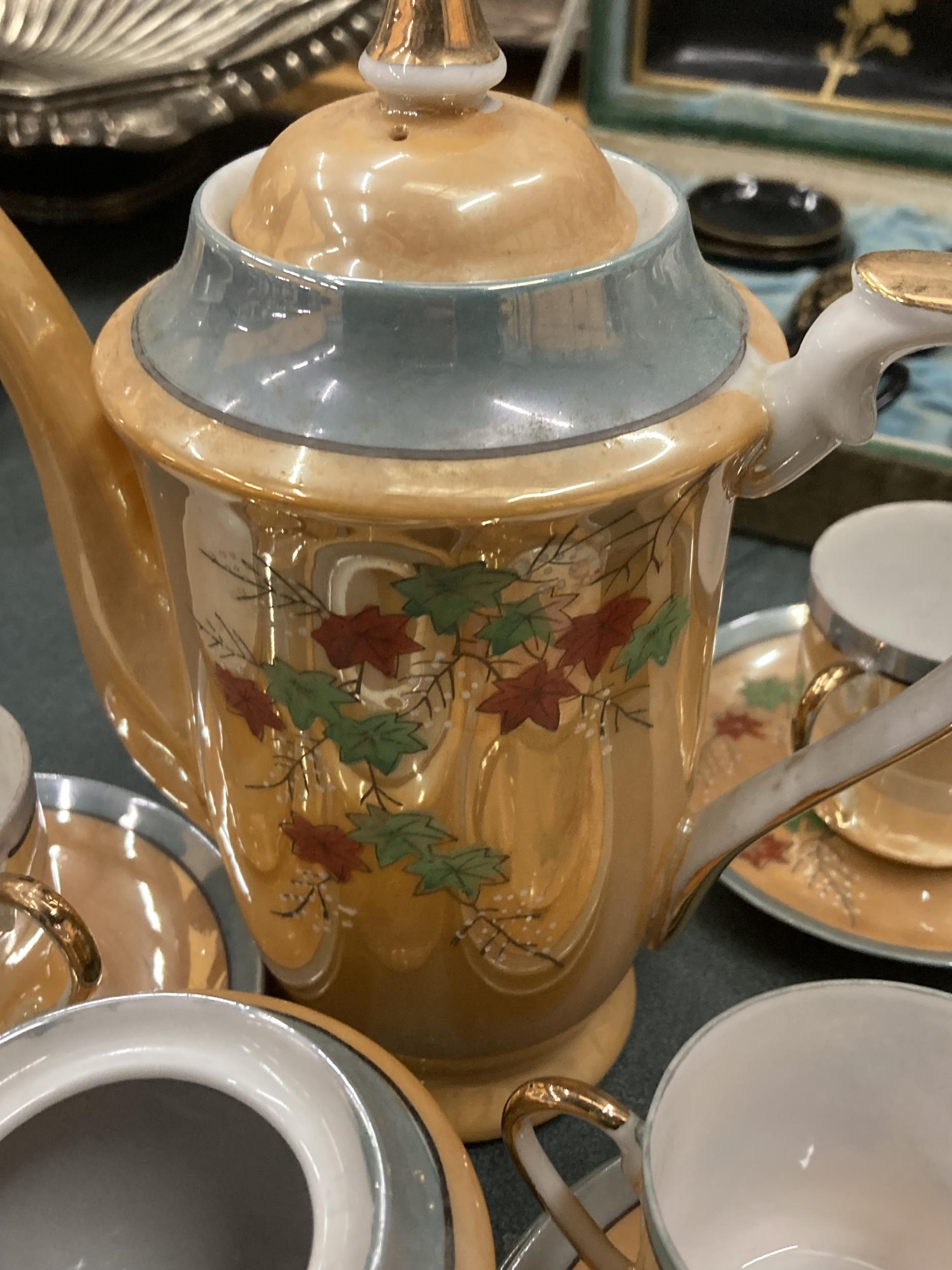 AN ORANGE LUSTRE COFFEE SET TO INCLUDE A COFFEE POT, SUGAR BASIN CUPS AND SAUCERS PLUS A SET OF - Image 4 of 6