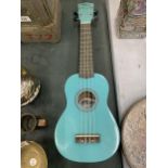 A 'TIGER' TURQUOISE COLOURED UKELELE