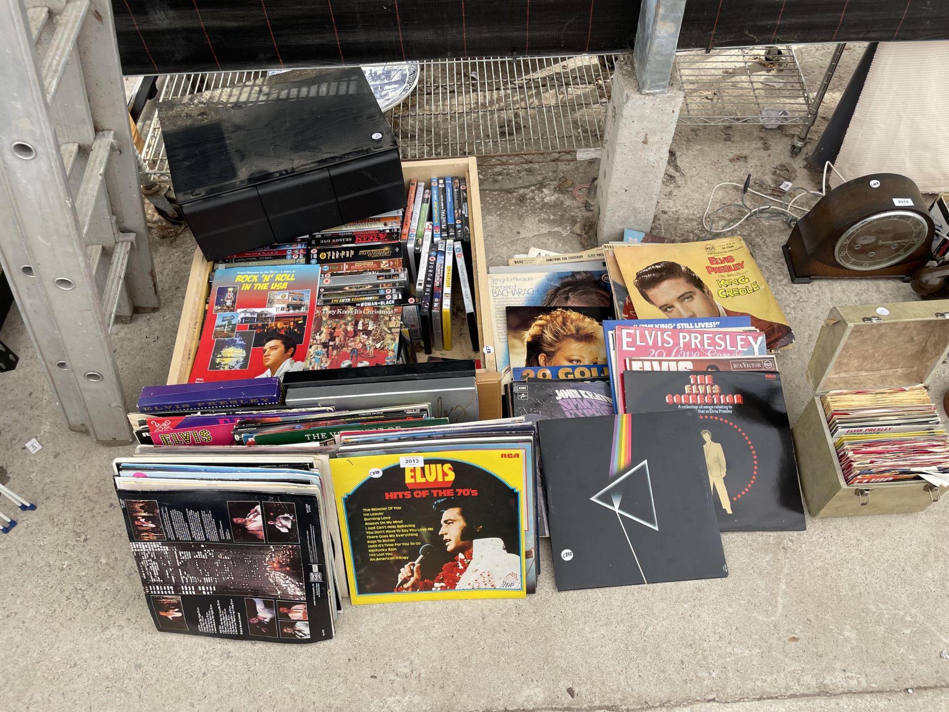 AN ASSORTMENT OF DVDS AND LP RECORDS