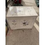 A FLORAL DECORATED WOODEN STORAGE BOX