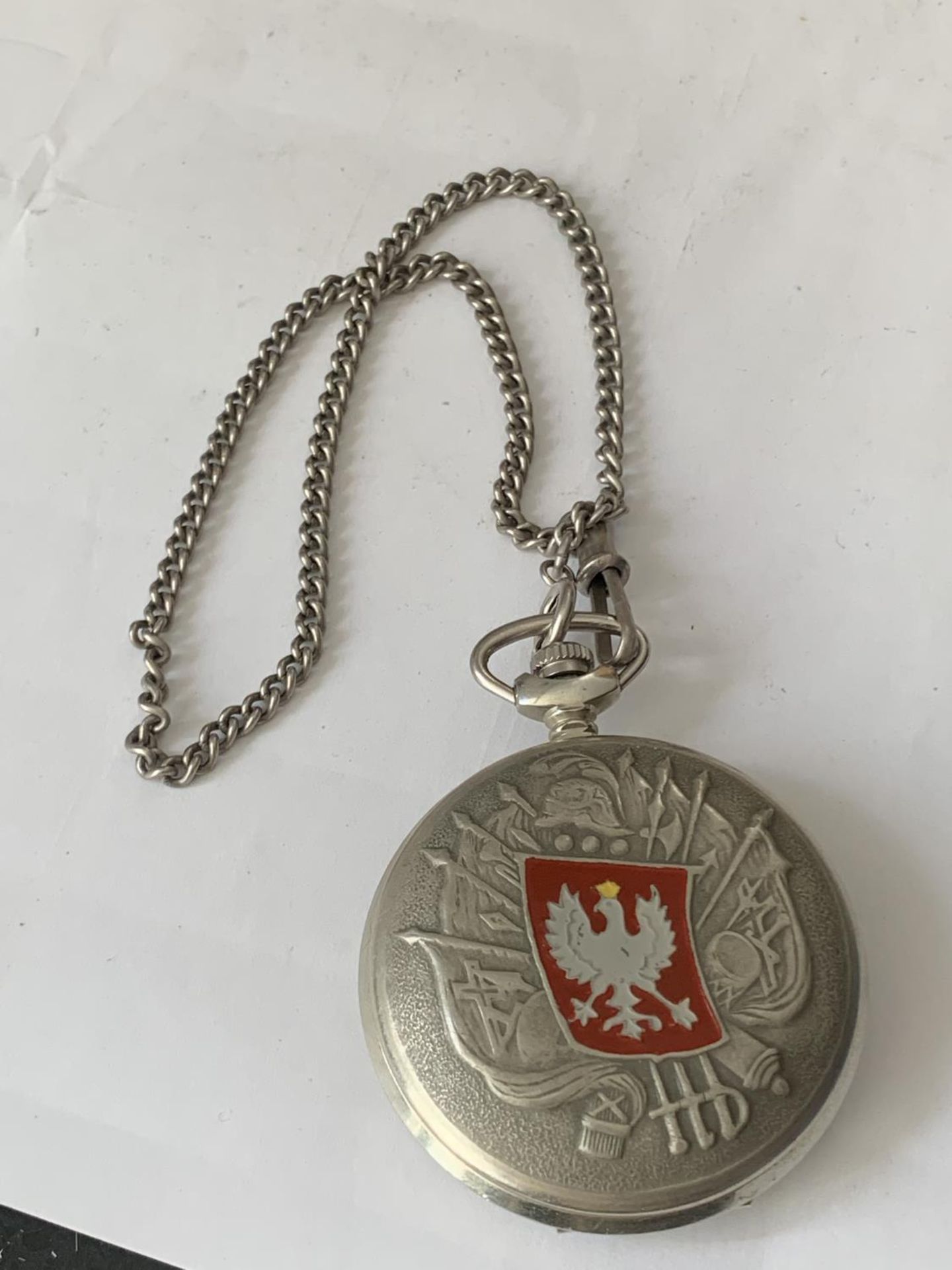 A POCKET WATCH WITH IMPERIAL RUSSIAN EAGLE ON THE FRONT AND A POLISH EAGLE TO THE REAR