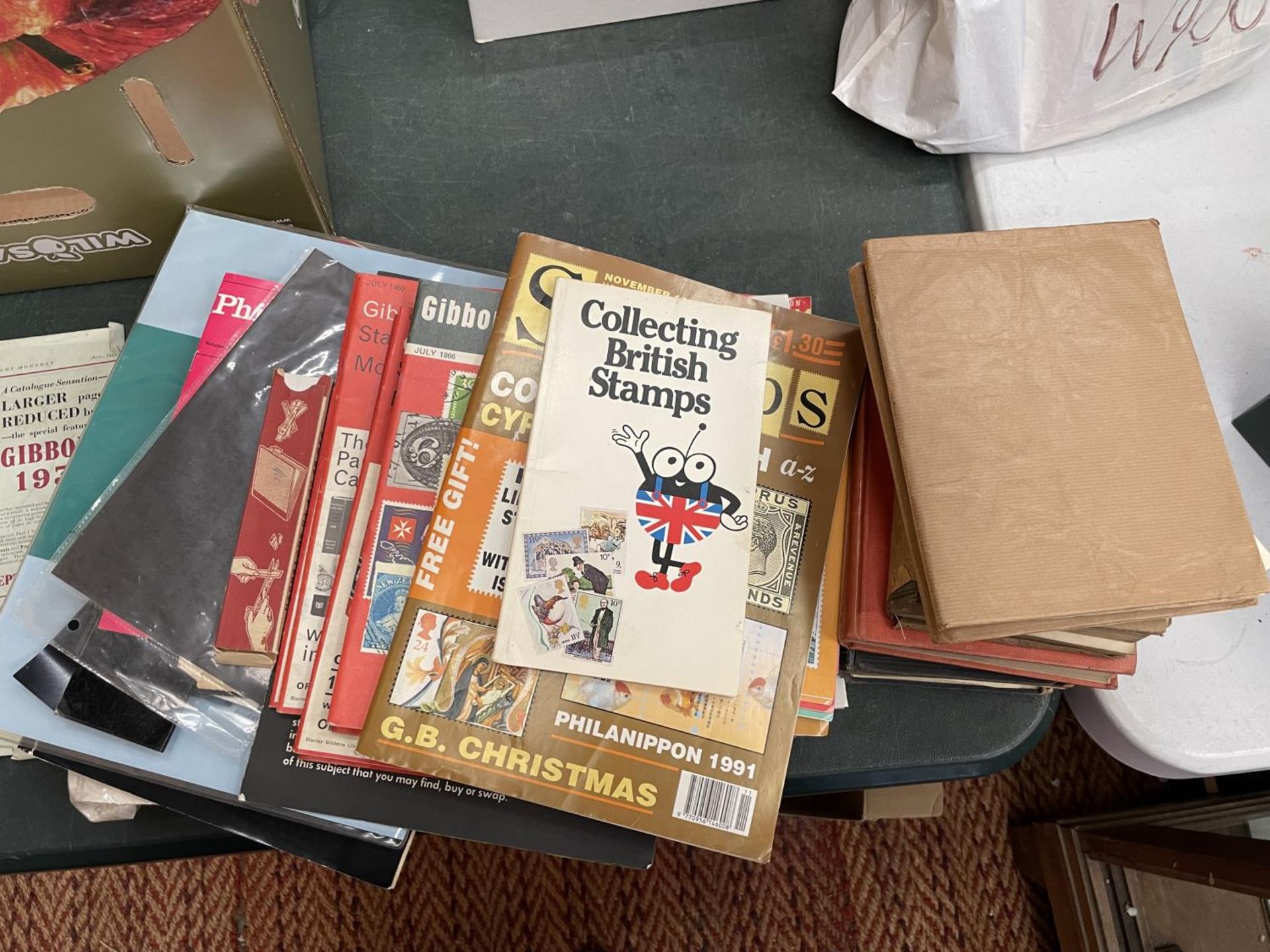 A QUANTITY OF STAMP COLLECTING RELATED BOOKS