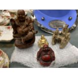 A COLLECTION OF THREE BUDDAHS AND AN ORIENTAL FIGURE GROUP