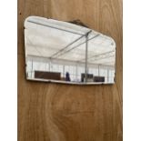 AN ART DECO UNFRAMED BEVELED EDGE WALL MIRROR WITH HANGING CHAIN